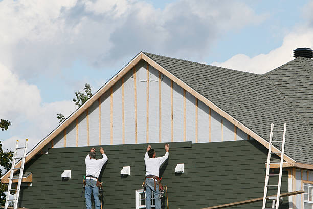Professional Siding Replacement technician working in Homestead, PA